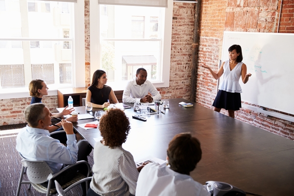 A facilitator explains what the team can expect from their sales training